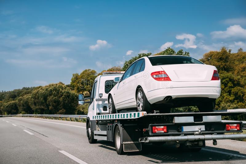 car-service-transportation-concept-tow-truck-transporting-help-road-transports-wrecker-broken-auto-towing-faults-164163595